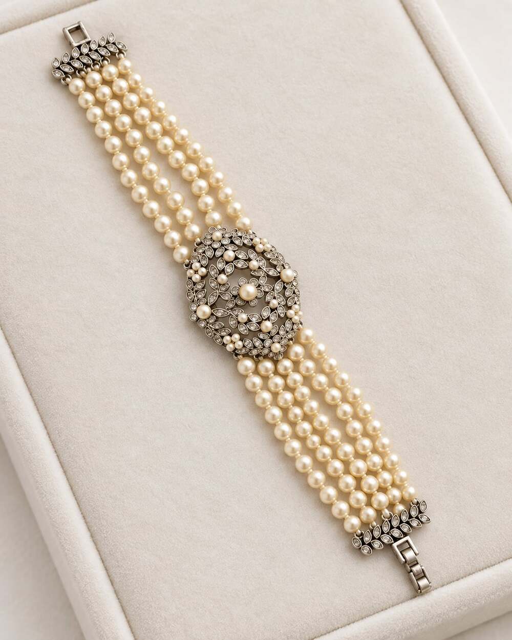 Elegant vintage MONET statement bracelet featuring multiple strands of creamy fa